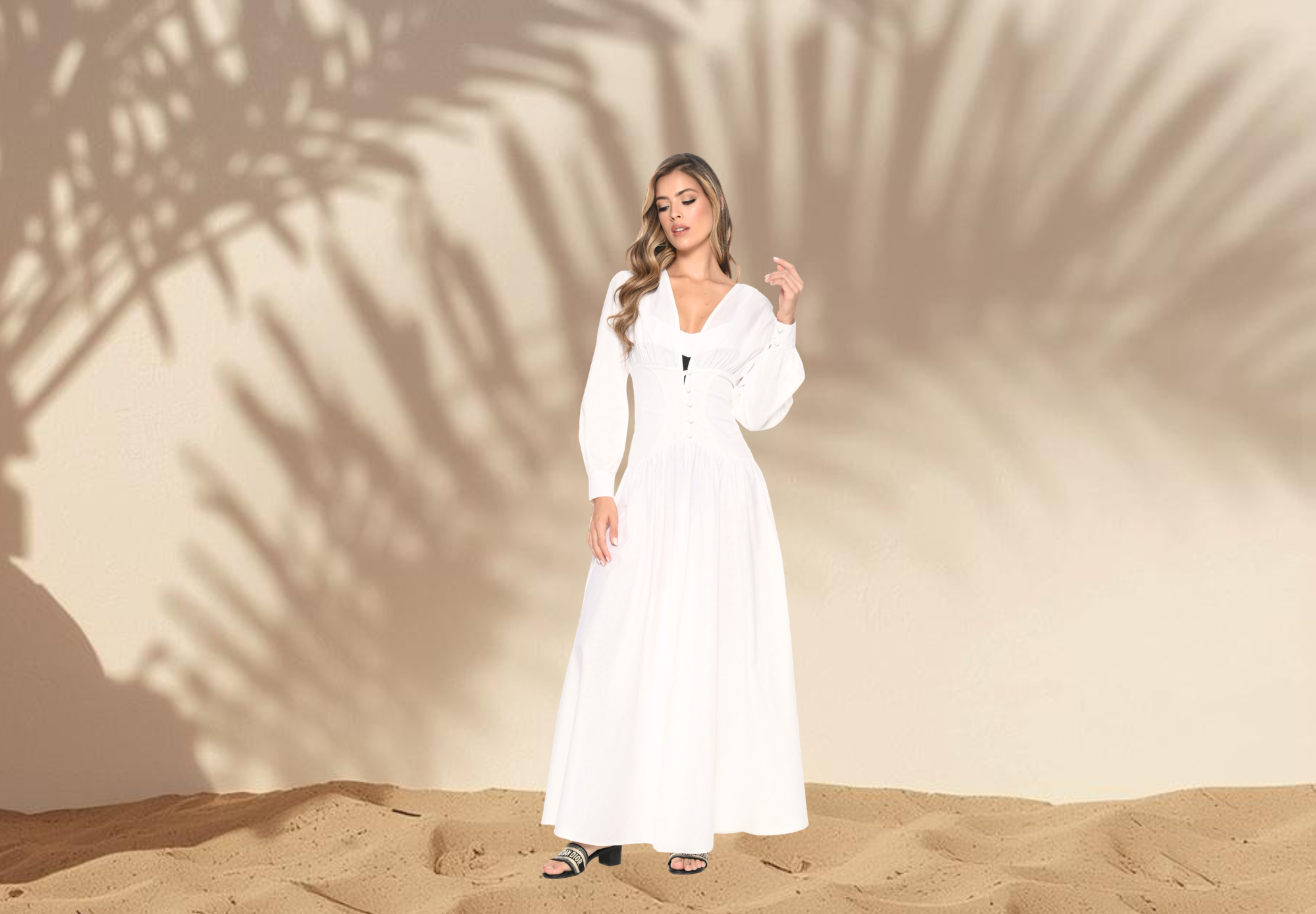 After: model wearing a long-sleeve white resortwear dress on the beach — Verde Mar